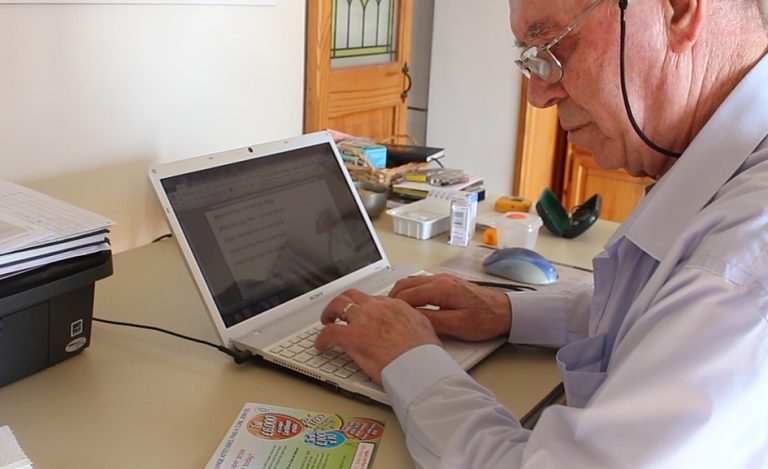 Man Looks at computer