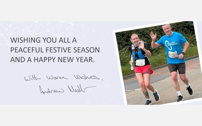 Seasonal card reading: Wishing you all a peaceful festive season and a happy new year, with warm wishes from Andrew Mullen, beside a photo of two runners